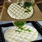 Einfaches, hausgemachtes Knoblauchbrot auf einem Holzbrett angerichtet