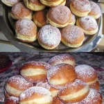 Fluffige Silvester Krapfen auf einem Teller, ideal für den Jahreswechsel