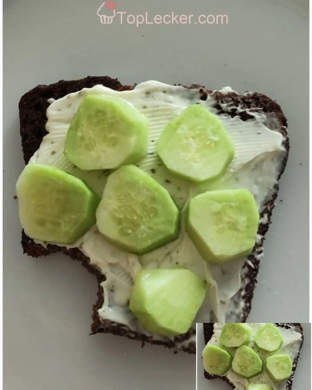 Brot mit Frischkäse und Gurke auf einem Teller serviert