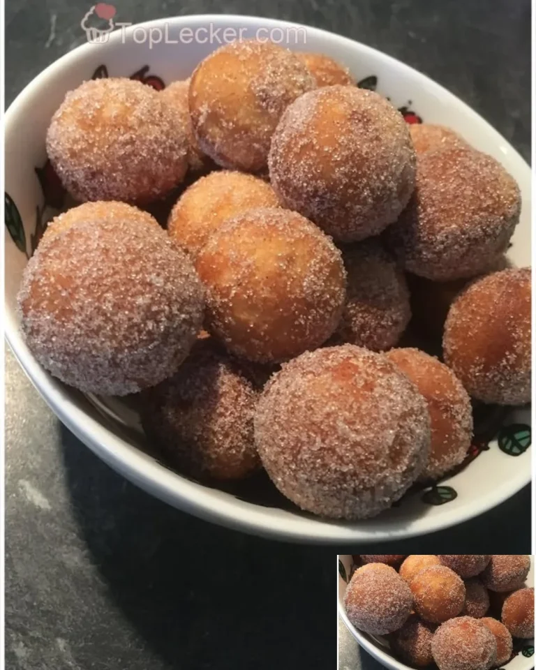 Leckere Quarkbällchen mit Zimt-Zucker auf einem Teller