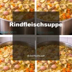 Schüssel mit Rindfleischsuppe, reich an Gemüse und aromatischen Kräutern.