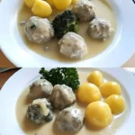 Königsberger Klopse serviert mit einer cremigen Sauce und Beilagen.