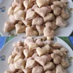 Omas Rahmplätzchen auf einem Teller, frisch gebacken und dekoriert