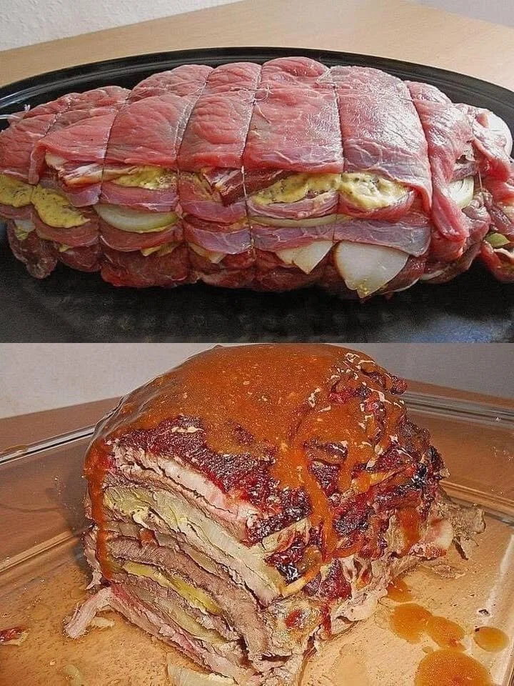 Schichtbraten in Senfsauce auf einem Teller serviert, dekoriert mit frischen Kräutern.