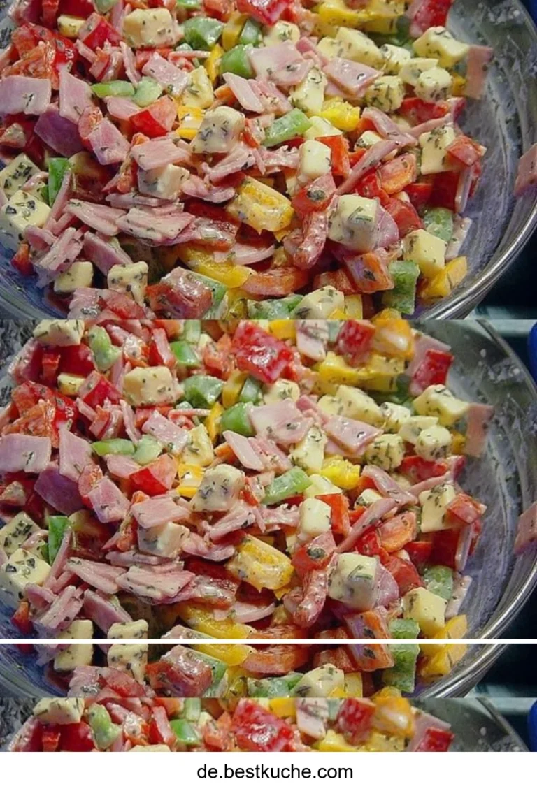 Schinken Salat mit Käse und Paprika auf einem weißen Teller serviert